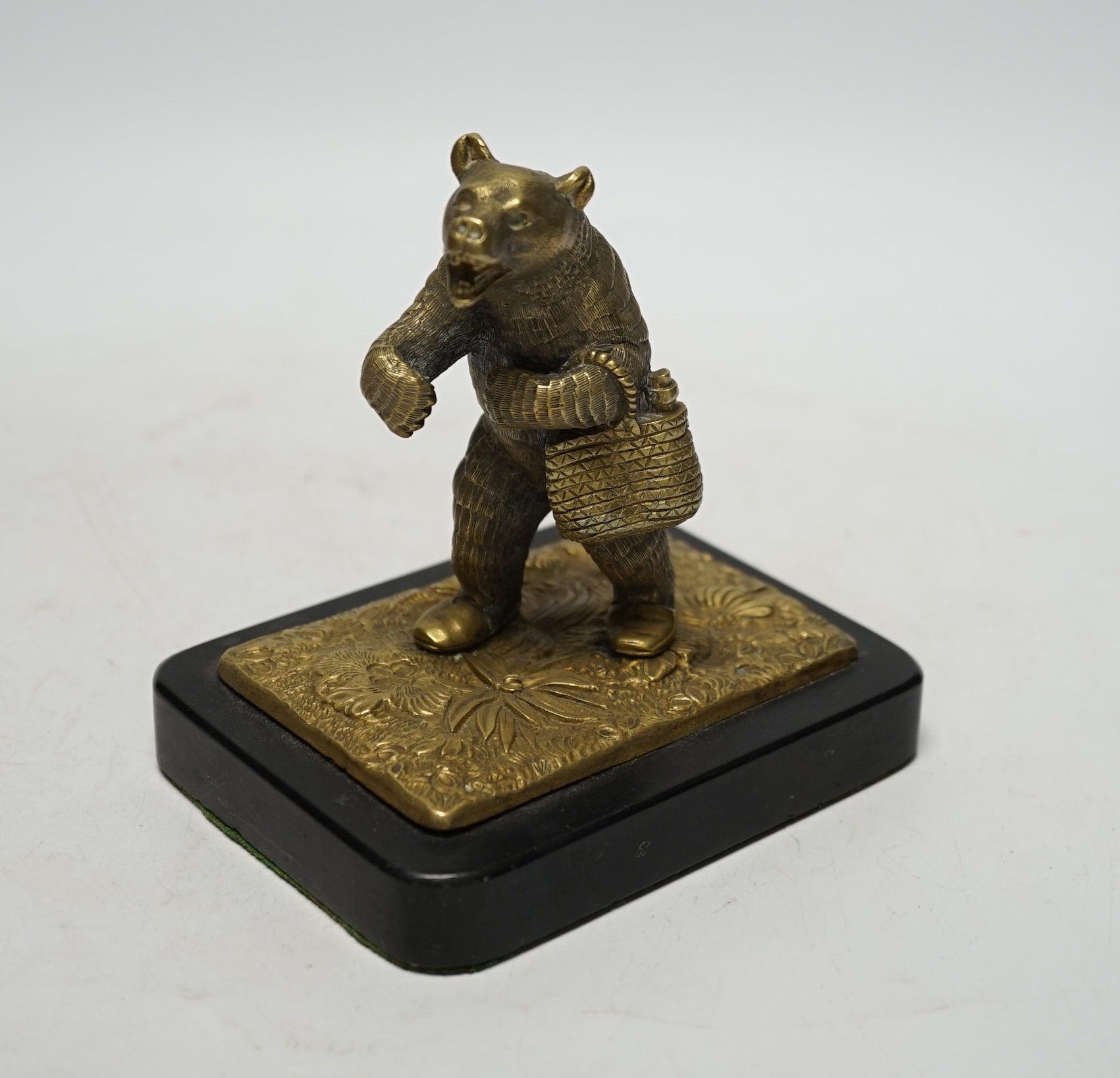 A novelty bronze bear paperweight on stand, 12.5cm high